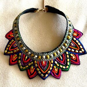 Artisan created bib beaded embroidered in golden threads soft felt backing